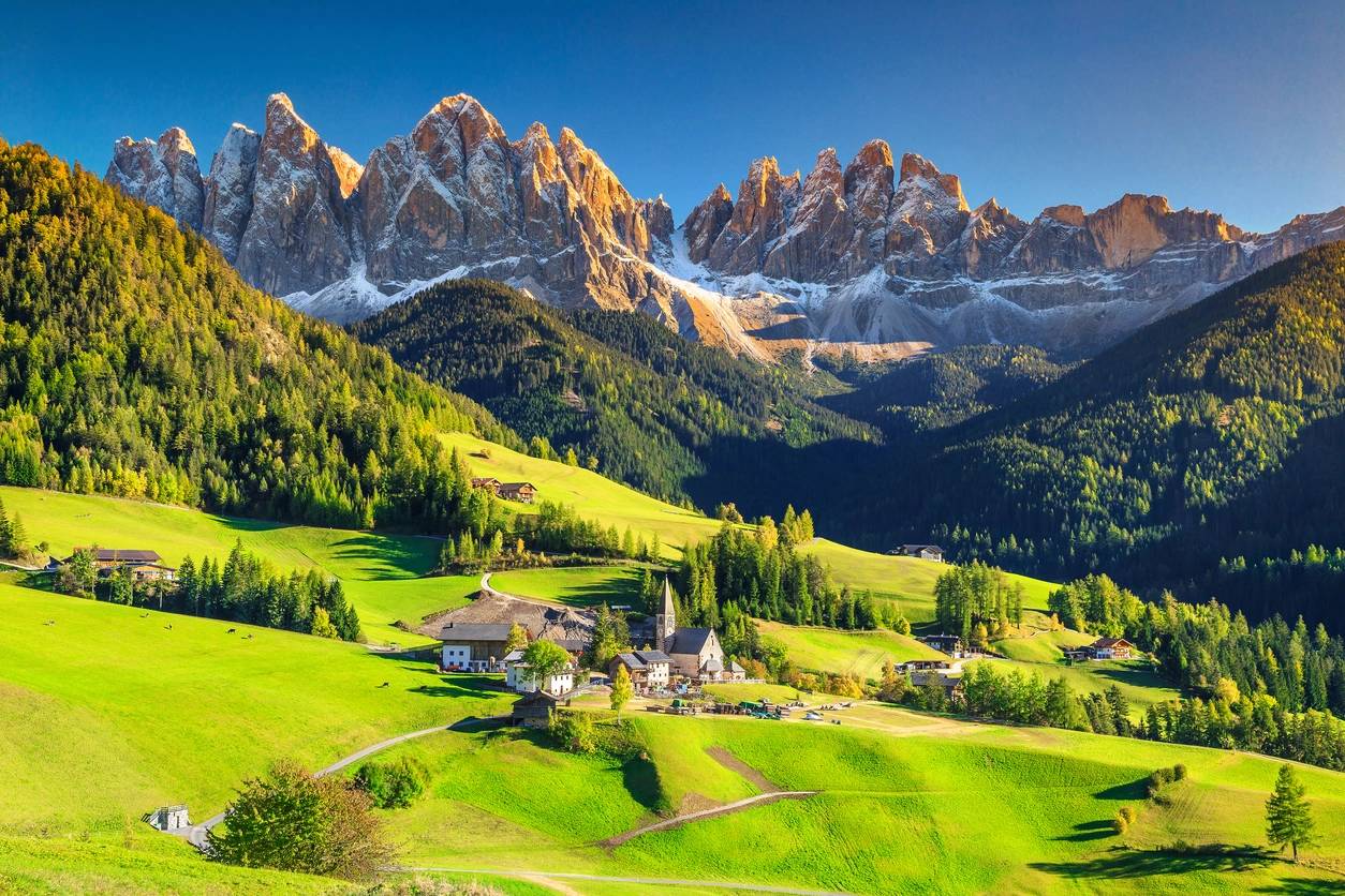 An Austrian style village scene showing the beautiful mountains highlighting th places you can visit and promote as a travel agent 